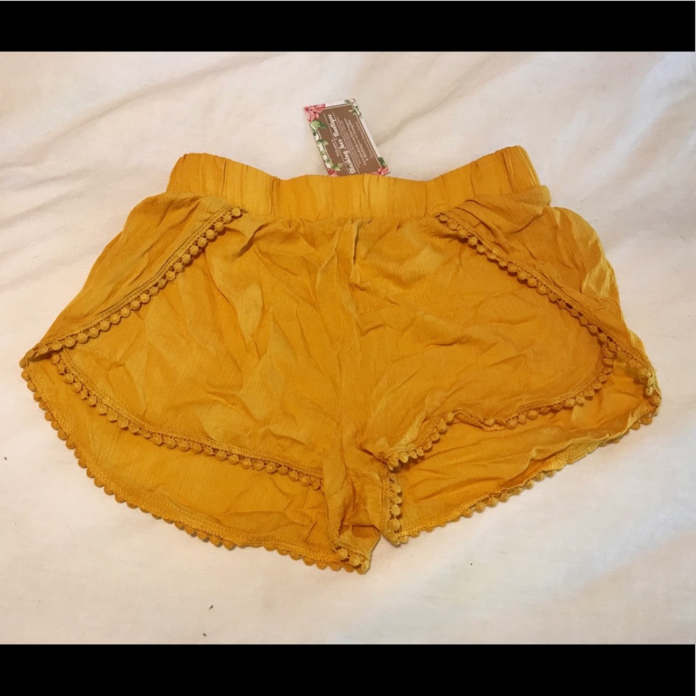 Yellow pom trim shorts